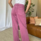 High-rise garment dye wide leg jeans in rich pink, shown from the back on a woman wearing a white top.