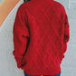 Woman wearing Bella Road Diamond Round Neck Long Sleeve Sweater in red, showing intricate diamond pattern on the back.