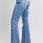 Stylish Judy Blue high rise bootcut jeans with raw hem, flattering fit, and vintage-inspired flare, perfect for a trendy look.