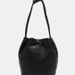 Nicole Lee USA Amy Studded Bucket Bag in black vegan leather with drawstring closure and stud detailing.