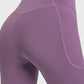 Stylish Millennia V-Waist Yoga Leggings in purple with flattering fit and side pocket, perfect for yoga practice.