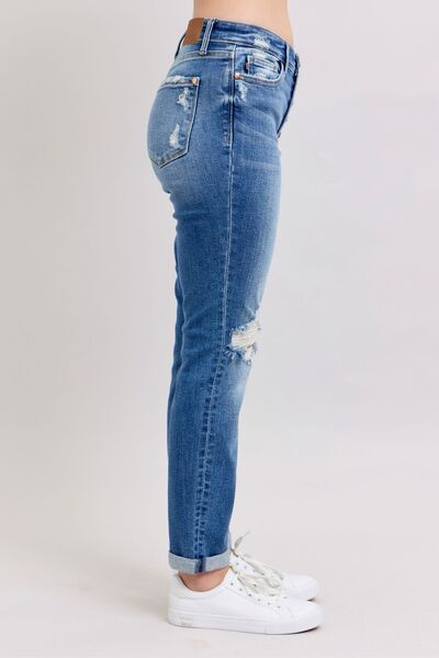 Side view of Judy Blue button fly distressed jeans with pockets, perfect casual wear for plus-size style.