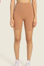 Millennia Seamless High-Rise Wide Waistband Biker Shorts in tan, perfect for comfort and style during workouts or lounging.