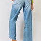 High Waist Wide Leg Jeans with back pockets, cowboy boots and a colorful top, showcasing a classic wide-leg design and regular hem