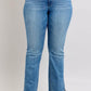 Judy Blue high waist vintage wash bootcut jeans with tummy control and a stylish fit, featuring a modern side slit detail.