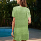 Woman wearing a sheer green Bella Road Swim cover-up by the pool, showcasing its openwork design and short sleeves.