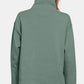 Back view of Zenana Turtleneck Half Snap Fleece Sweatshirt in soft green, showcasing cozy style and comfort.