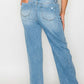 Woman showcasing distressed high rise straight jeans from the back, featuring a classic light blue wash and relaxed fit.