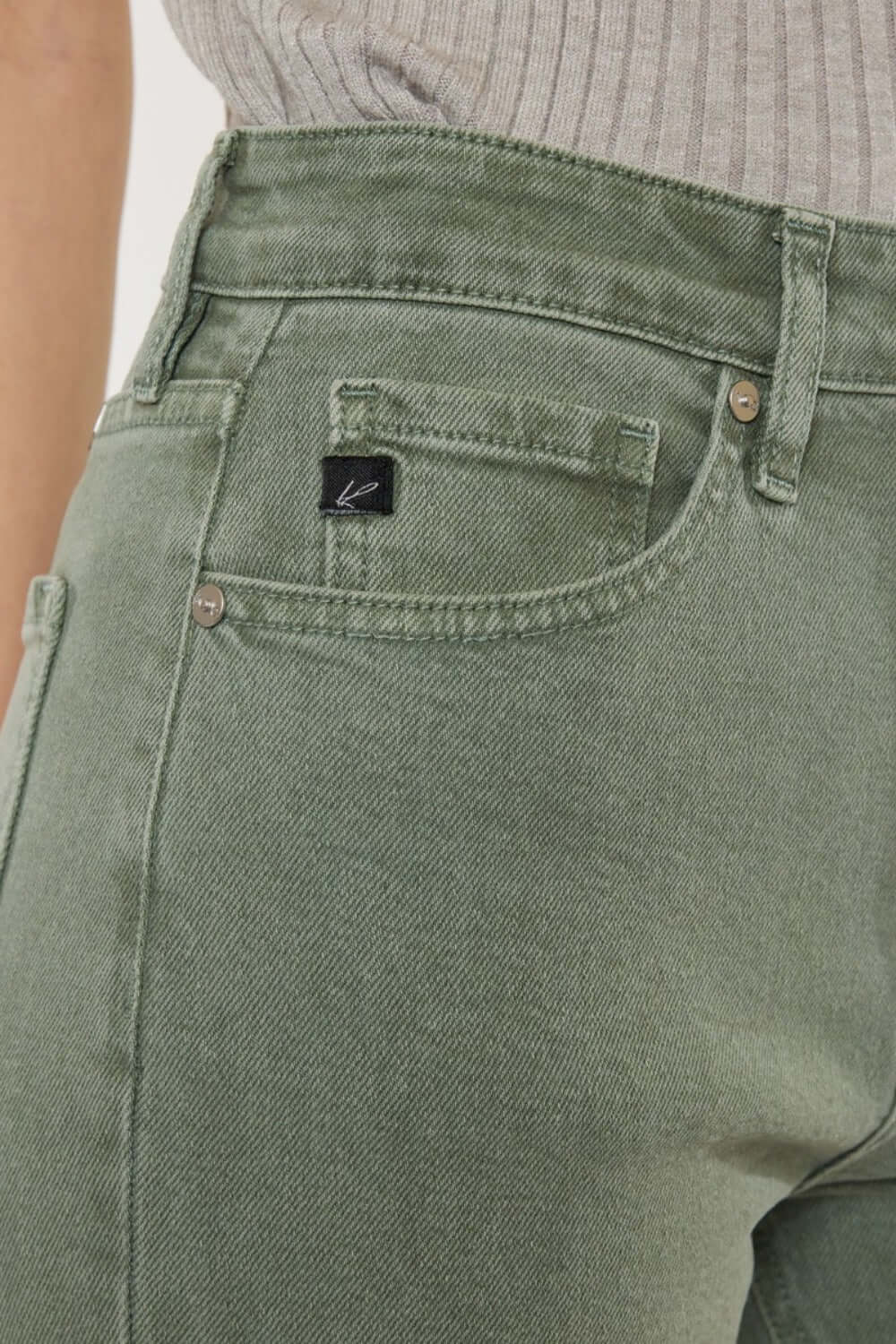 Close-up of Kancan Ultra High Rise Straight Jeans in vintage olive, highlighting pocket detail and comfortable stretch denim.