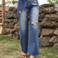 Bella Road distressed jeans with stylish pockets in a navy shade, featuring a relaxed fit and slightly stretchy fabric.