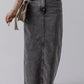 Woman wearing Bella Road Raw Hem Midi Denim Skirt with pockets, showcasing edgy style and comfort for any adventure.