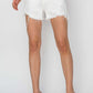 Risen Jeans Button Fly Frayed Hem Denim Shorts in white, modeled with a chic summer look, showcasing stylish button fly closure and frayed hem detailing.