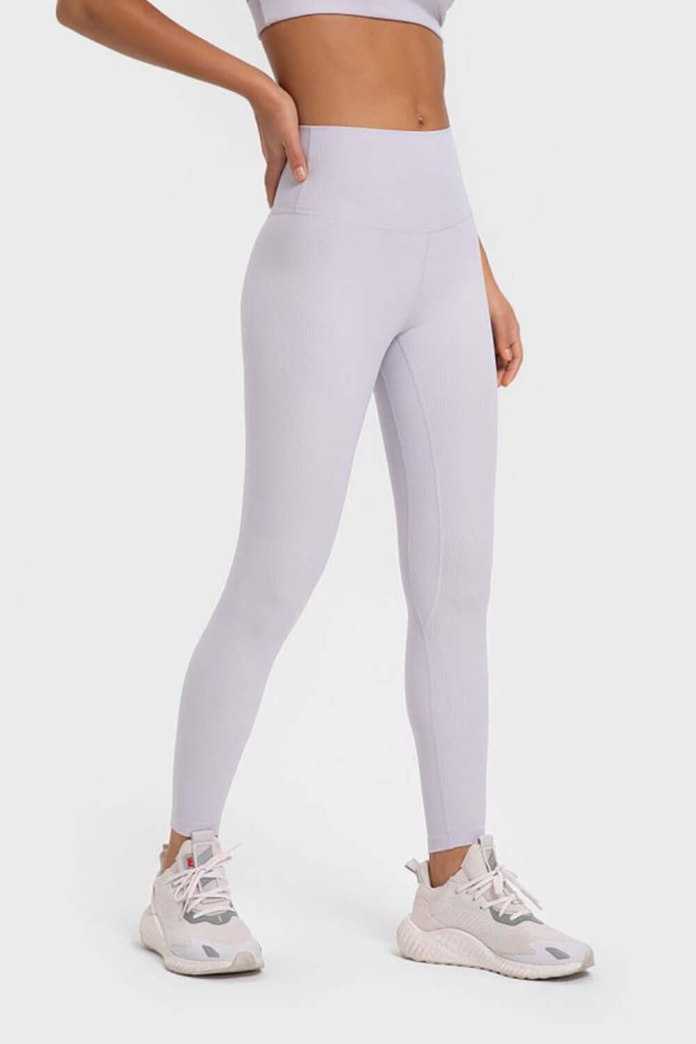 Millennia highly stretchy wide waistband yoga leggings in light lavender, perfect for ultimate comfort and flexibility during workouts.