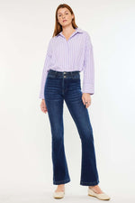 Woman wearing Kancan High Rise Double Waistband Flare Jeans with dark wash and striped blouse, showcasing stylish and comfortable fit.