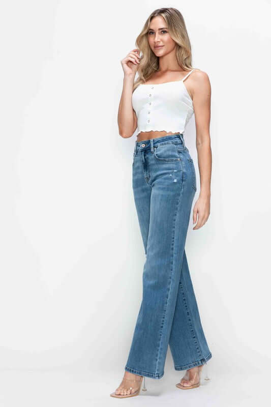 Model showcasing bytos high rise wide leg jeans with pockets, styled with a chic crop top. Perfect for trendy outfits!