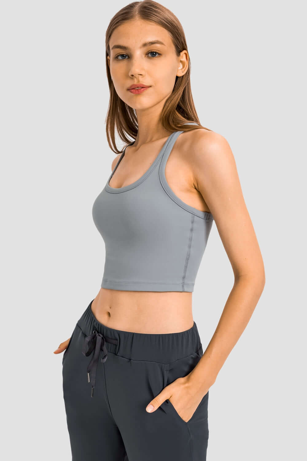 Millennia Racerback Sports Bra in gray, featuring a sporty design and removable padding for ultimate comfort during workouts.