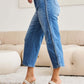 Stylish Judy Blue Jeans with braid side detailing and wide leg silhouette worn by model in chic setting