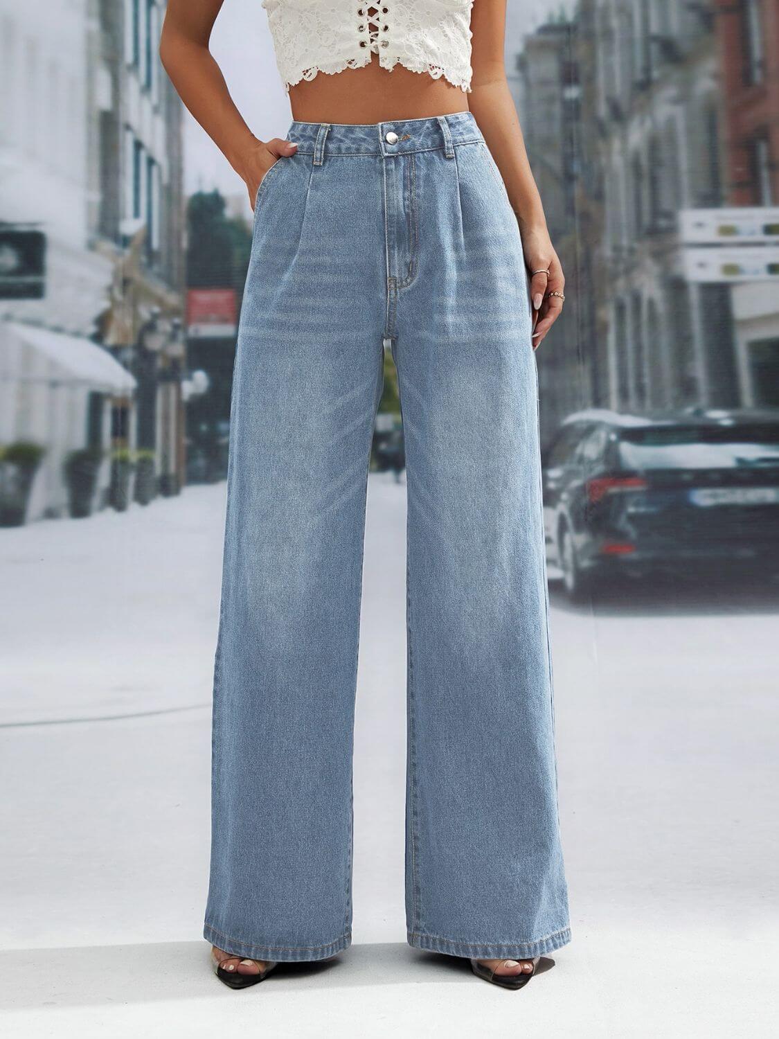 Woman wearing wide leg jeans with front pockets, buttoned design, slightly stretchy, 85% cotton, 15% polyester, background of urban street.