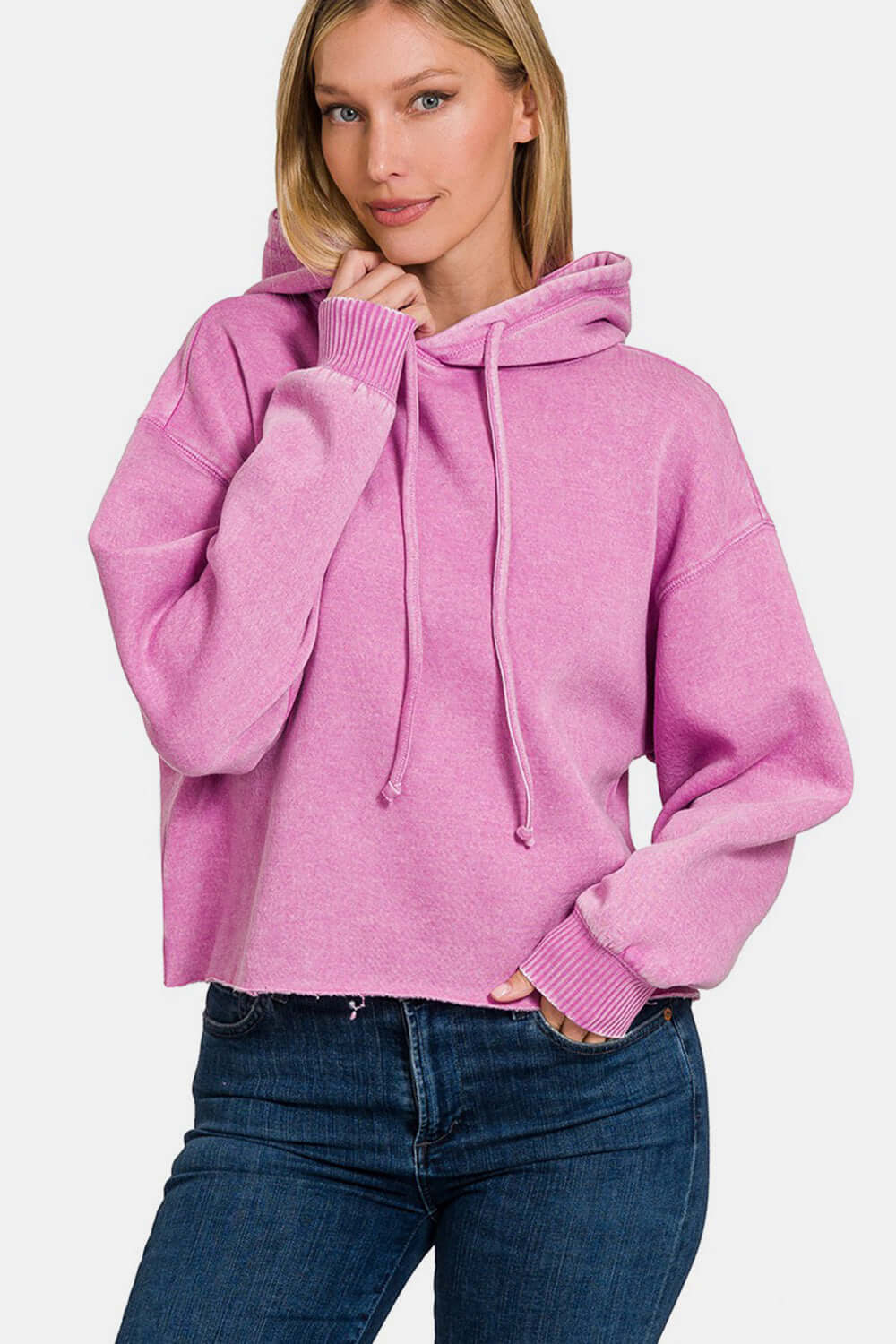 Trendy pink acid wash fleece cropped hoodie with cozy feel and edgy style. Perfect for casual wear and adding a unique touch to outfits.