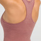 Back view of Millennia Round Neck Racerback Active Tank in soft pink, showcasing its racerback design for optimal movement.