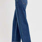 Side view of RISEN tummy control bootcut jeans in plus size, showcasing flattering fit and stylish flare.