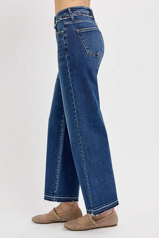 Side view of RISEN tummy control bootcut jeans in plus size, showcasing flattering fit and stylish flare.