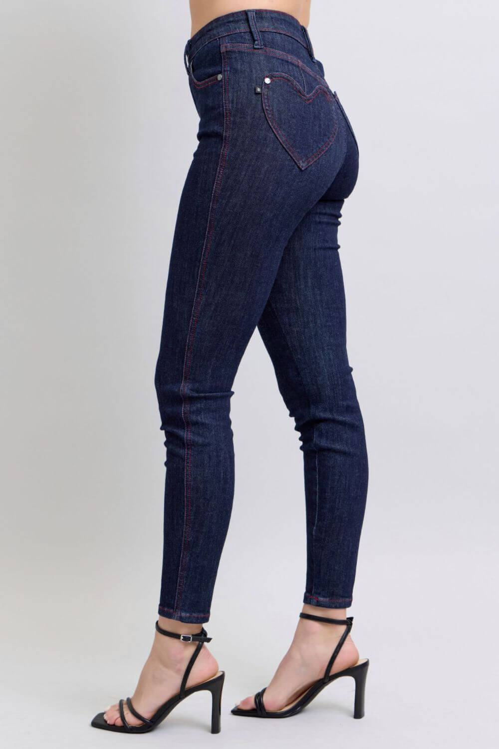 Stylish high-rise skinny jeans with heart-shaped back pockets, perfect for casual outings or a night out.