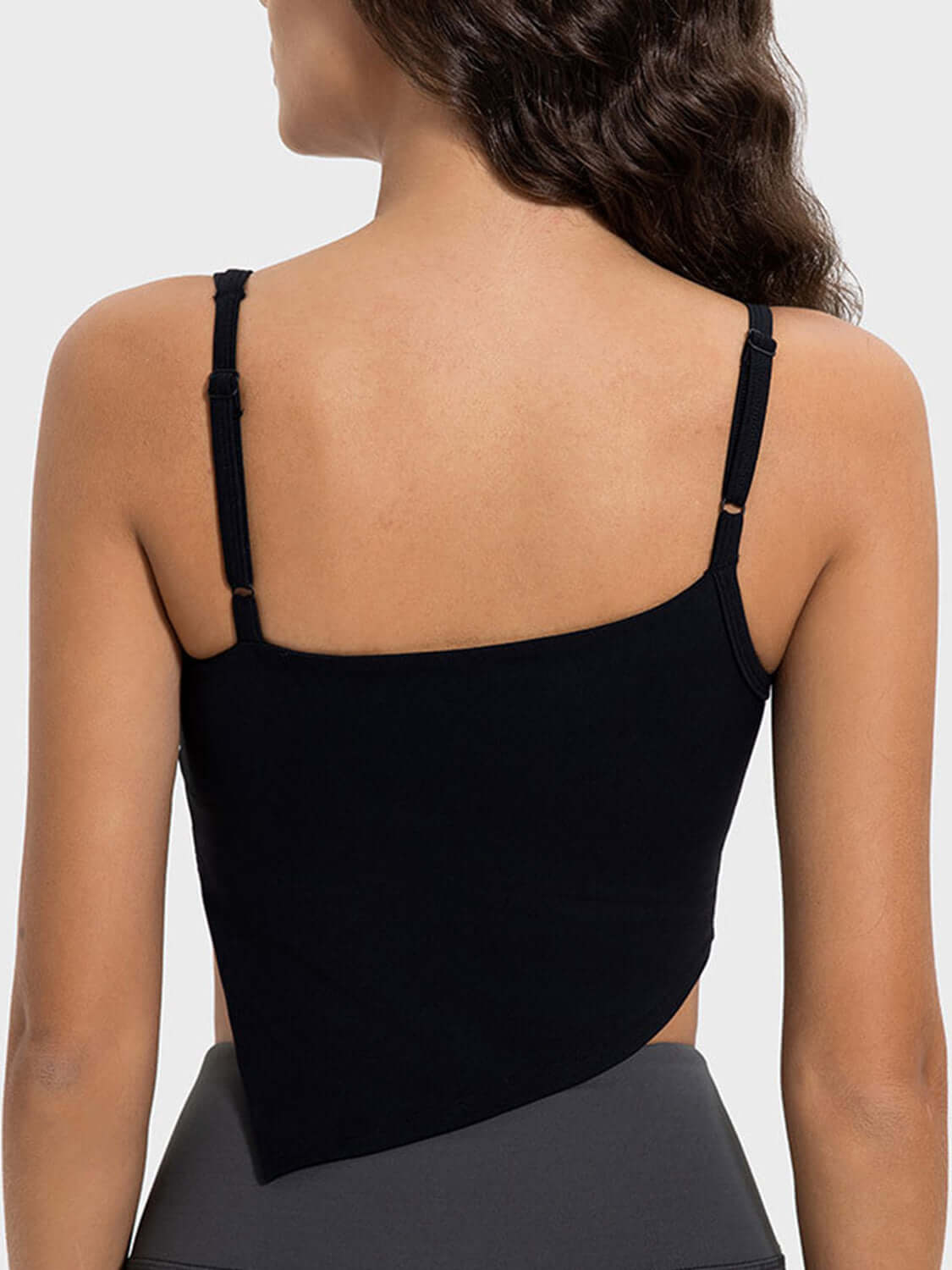 Back view of the Millennia Slit Asymmetrical Neck Active Cami, showcasing its stylish design and adjustable straps.