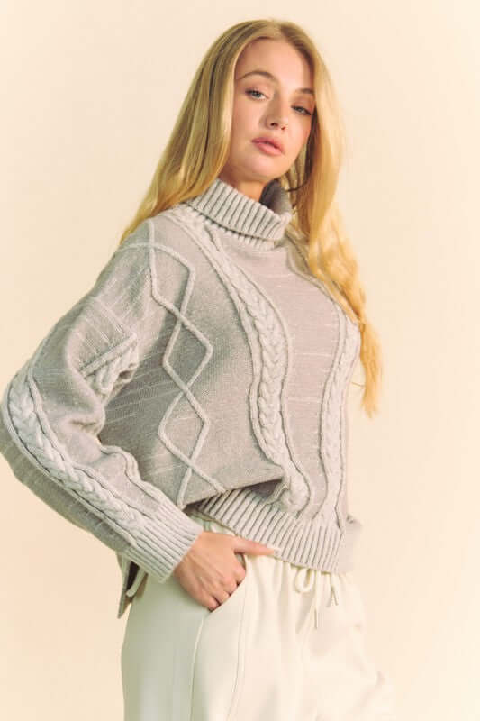 Cozy gray Davi & Dani cable-knit turtleneck sweater with a relaxed dropped shoulder silhouette. Perfect for chilly days!