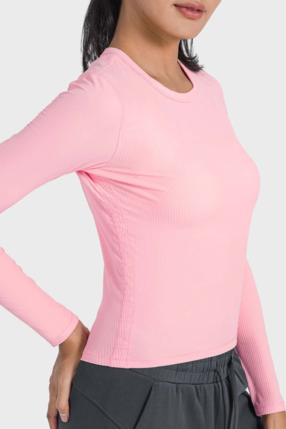 Millennia round neck long sleeve sports top in pink, perfect for workouts or lounging with stretchable, breathable fabric.