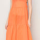 Halter neck orange maxi dress with loose-fit tiered silhouette, perfect for warm days and tropical getaways.