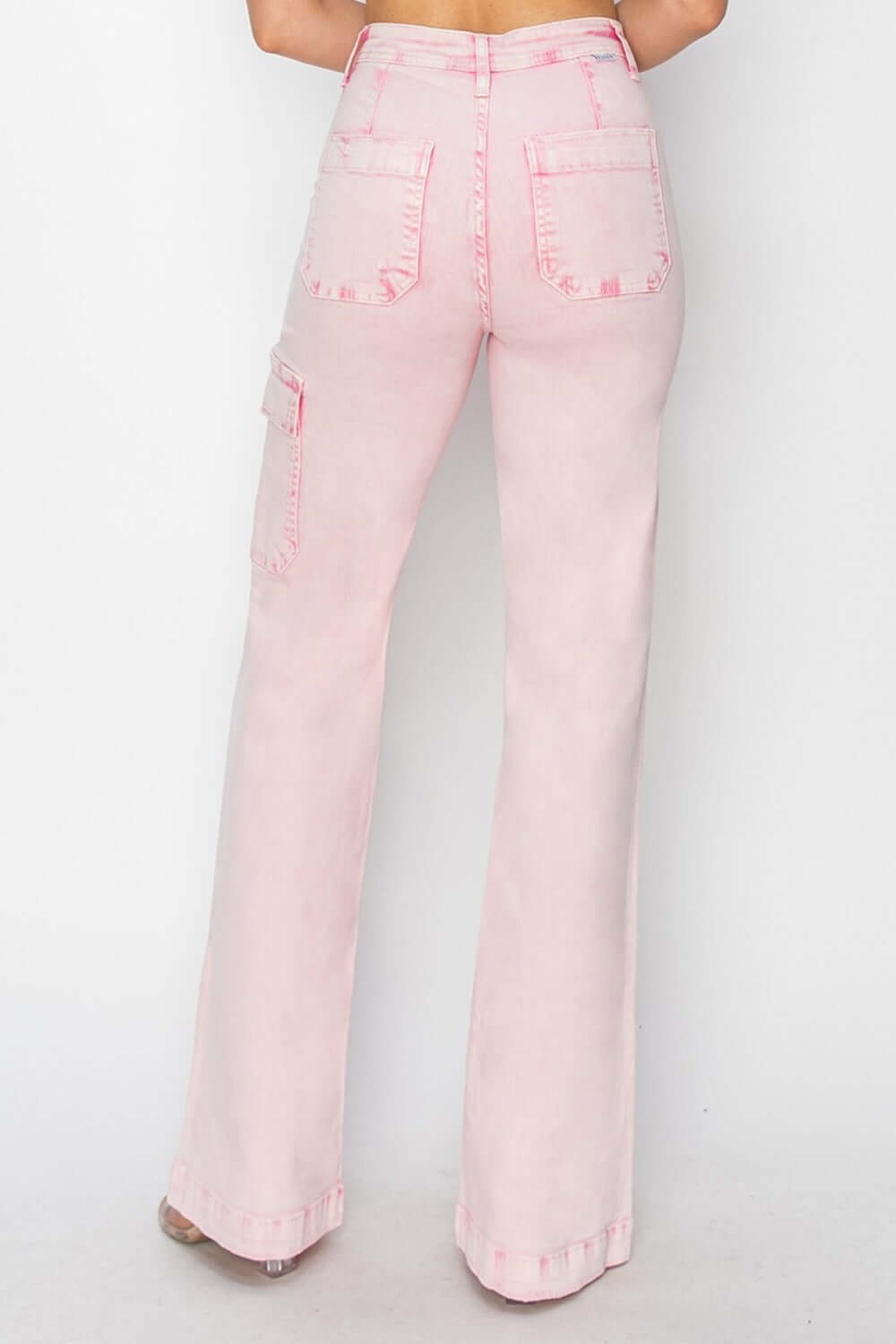 High-rise wide leg cargo pocket jeans in pink, showcasing flattering fit and trendy design from the back view.