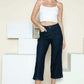 Woman wearing Judy Blue side seam braid detail crop wide leg jeans in dark denim with white top.