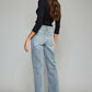 High Waist Raw Hem Cropped Wide Leg Jeans back view, featuring trendy raw hem detailing and a flattering silhouette for a stylish look