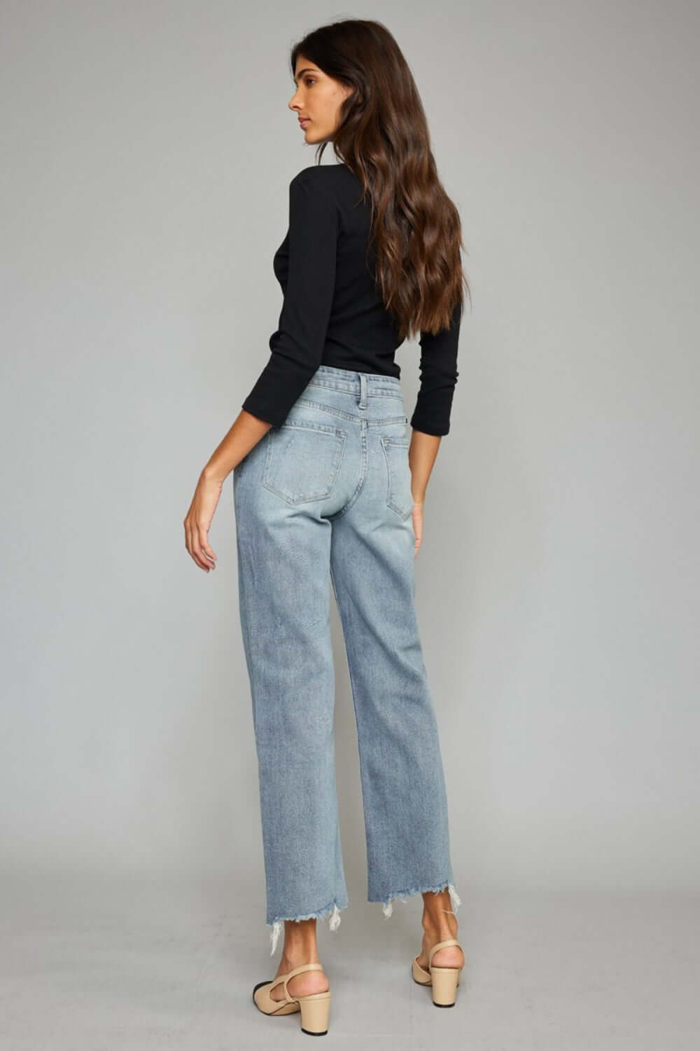 High Waist Raw Hem Cropped Wide Leg Jeans back view, featuring trendy raw hem detailing and a flattering silhouette for a stylish look