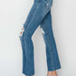 Trendy high rise distressed ankle jeans by Risen Jeans, paired with clear heels, showcasing flattering fit and versatile style