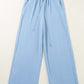 Bella Road Drawstring Wide Leg Jeans in light blue, featuring a comfortable drawstring waist and relaxed wide-leg design.