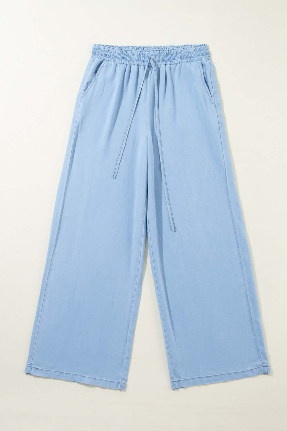 Bella Road Drawstring Wide Leg Jeans in light blue, featuring a comfortable drawstring waist and relaxed wide-leg design.