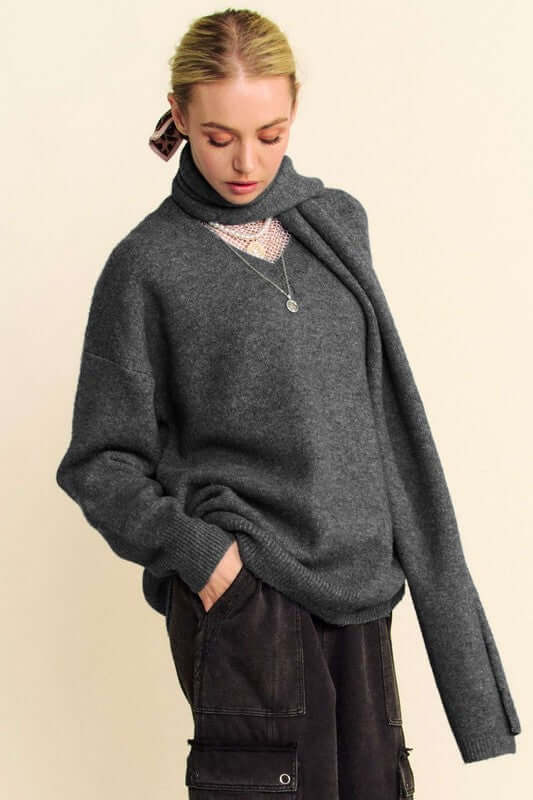 Stylish model in a charcoal V-neck sweater with scarf, showcasing a relaxed fit and chic comfort. Perfect for any occasion.