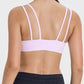 Back view of Millennia Scoop Neck Double Strap Active Cami in pink, showcasing its stylish double strap design.