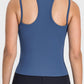 Back view of the Millennia Cutout Racerback Active Tank in blue, showcasing its unique cutout design and comfortable fit.