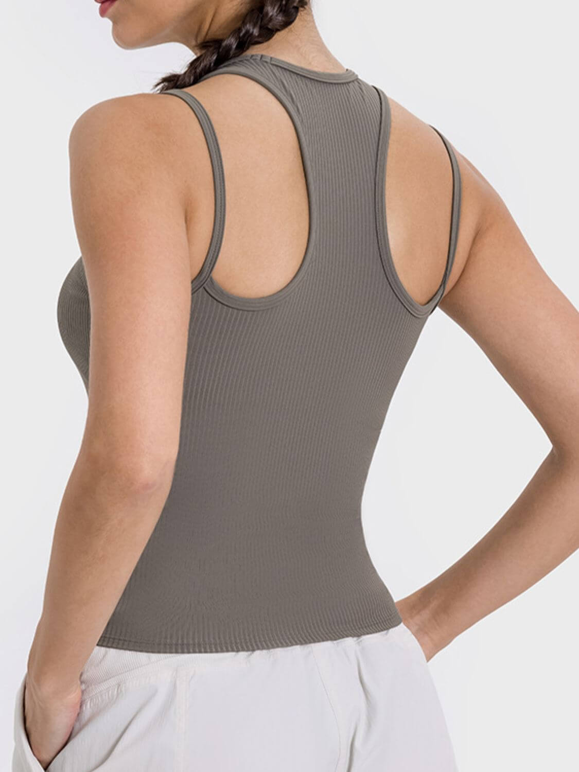 Stylish back view of the Millennia Cutout Racerback Active Tank, highlighting its unique design and comfortable fit.