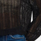 Black hollow out long sleeve knit cover up with intricate detailing, perfect for trendy layers over casual denim jeans.