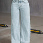 Light wash wide leg denim jeans with pockets and bow back design, perfect for chic casual outfits.