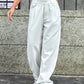 Bella Road wide leg jeans with pockets in white, worn with a crop top, featuring a buttoned and pocketed low waist design.