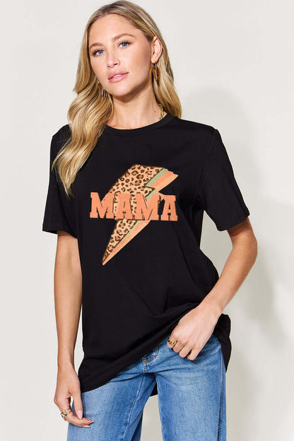 Woman wearing a black MAMA round neck short sleeve T-shirt with leopard print design, paired with blue jeans