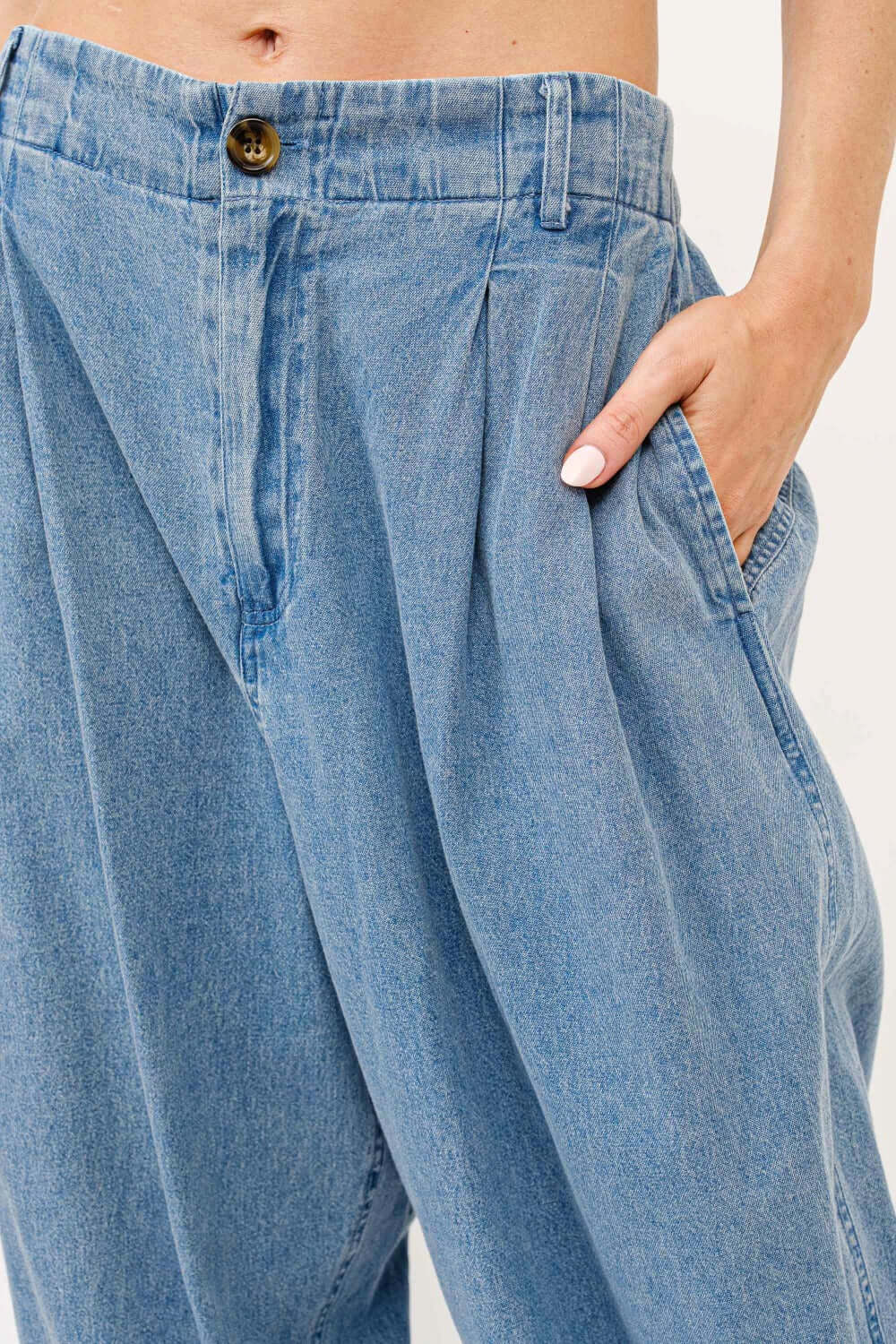 Elastic back pleated baggy jeans with pocket, showcasing relaxed fit and stylish pleated detail for casual outings.