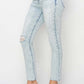 Risen high rise distressed skinny jeans with a figure-flattering fit and trendy ripped details, perfect for casual and versatile outfits.