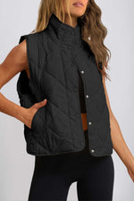 Woman wearing Bella Road Snap Down Texture Vest Coat in black, showcasing stylish fall/winter outerwear with pockets.