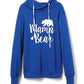 Blue drawstring hoodie with "Mama Bear" letter graphic and bear silhouette design on hanger.